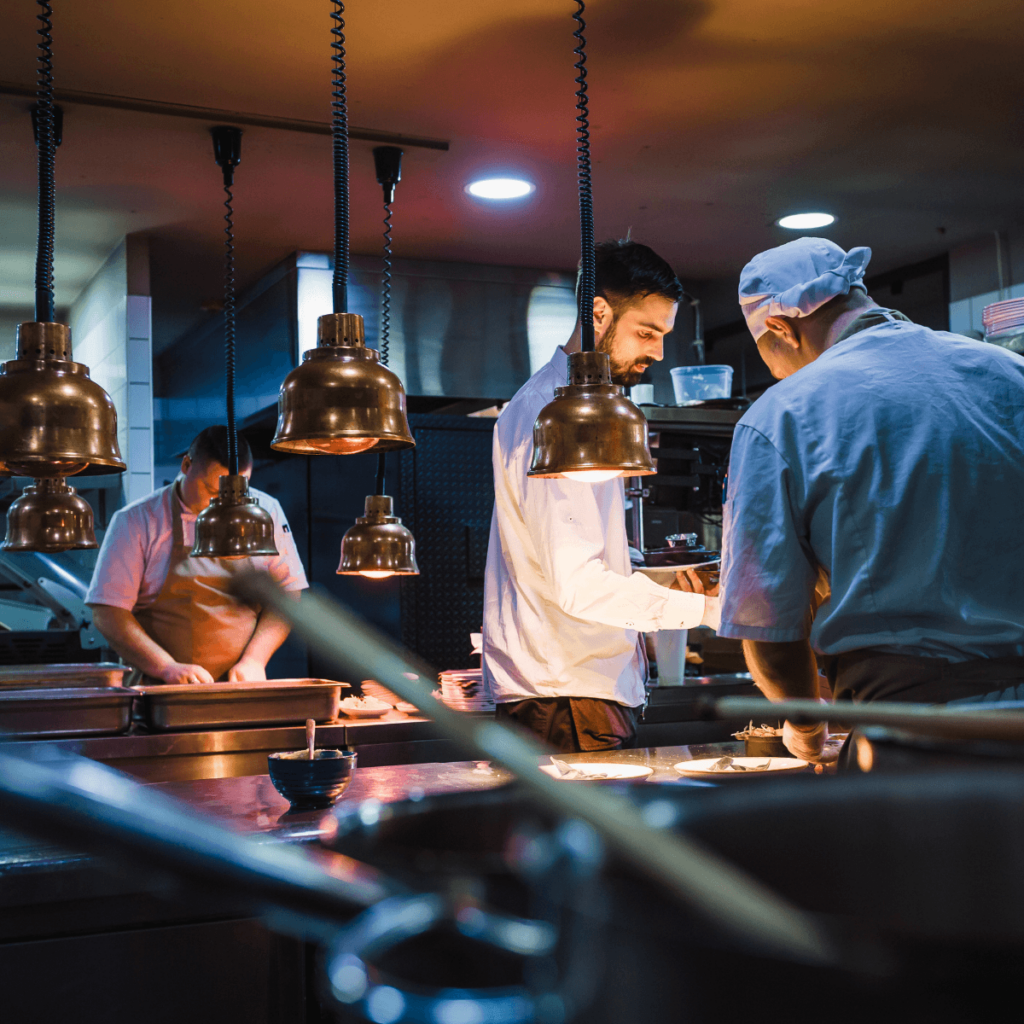 Professional kitchen with temporary chefs working