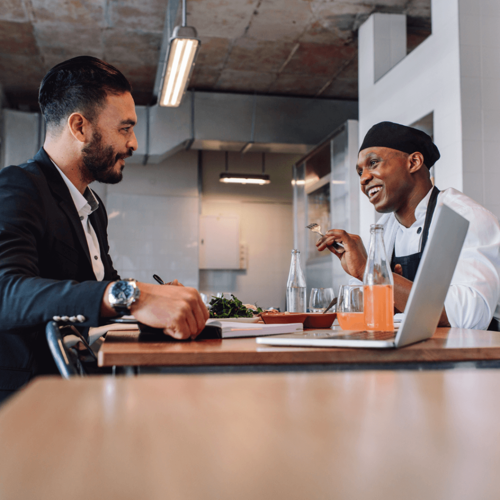 Chef asking his boss for a raise at a meeting table