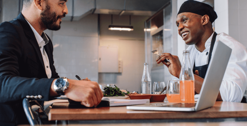 Chef asking his boss for a raise at a meeting table
