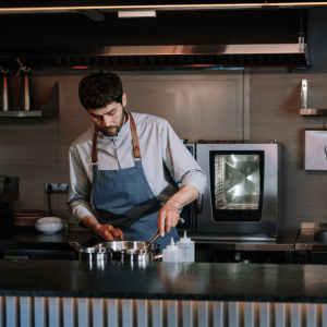 Image of an agency cooking in a restaurant kitchen