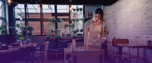 Food and Beverage Job Description: Image of a Waitress cleaning tables
