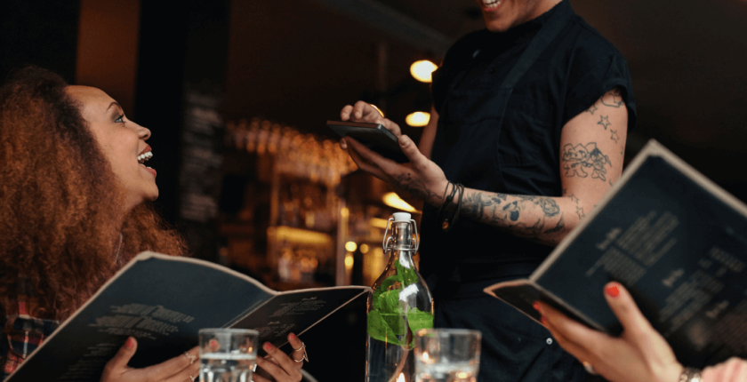 A Restaurant worker smiling on World Mental Health Day