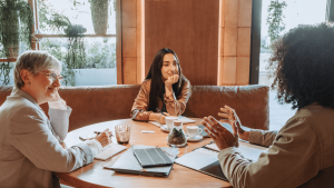 Hospitality team having a meeting in a restaurant setting