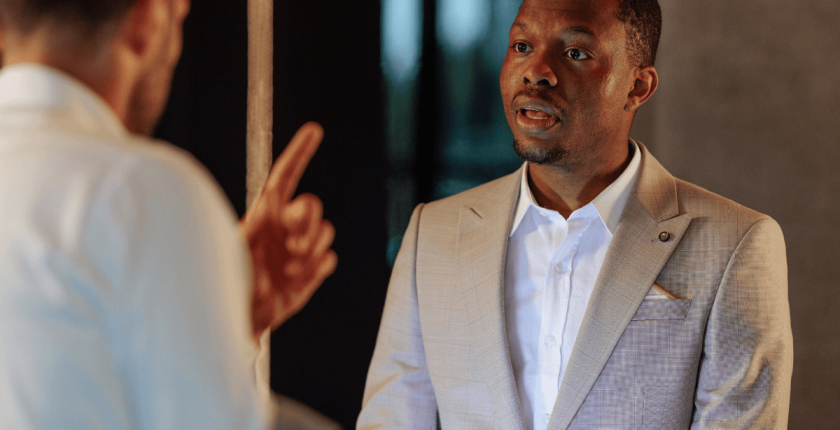 How to Handle Customer Complaints - hotel guest complaining to male receptionist