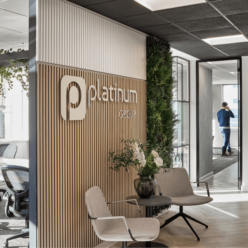 Platinum Recruitment office entrance with silver logo on a wooden wall