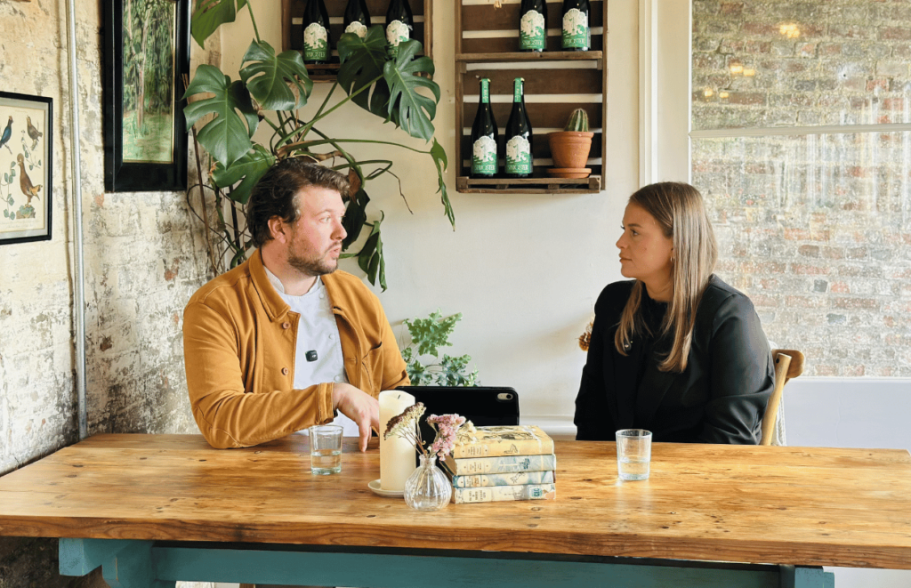 Chef Darren Broom sat at a table talkig to Platinum's Harriet Cook