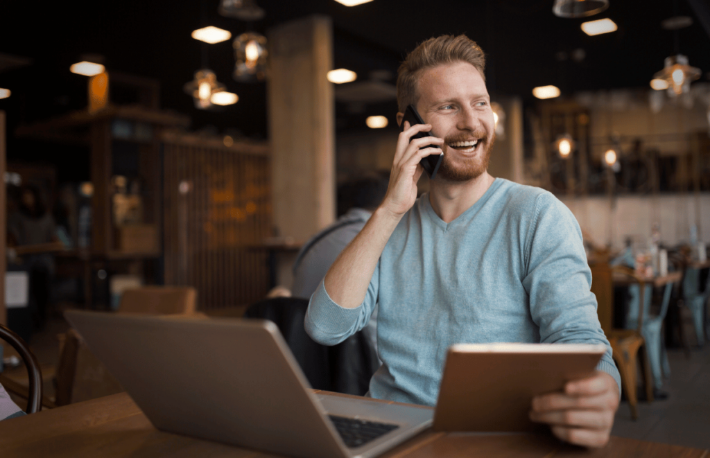 Man talking on a mobile phone in a restaurant