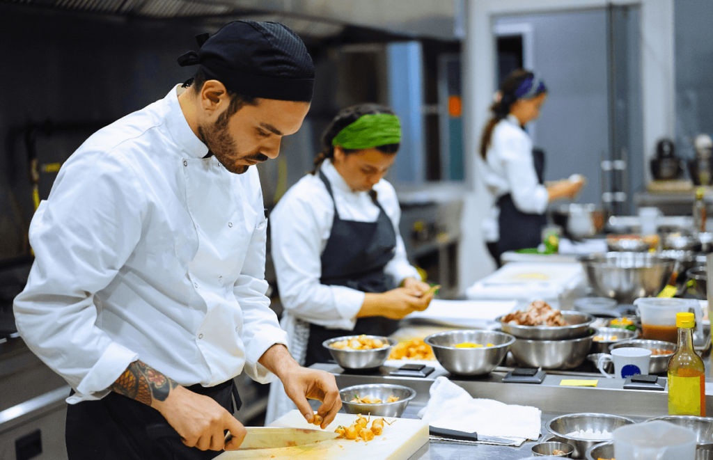 Chefs in training in a professional kitchen