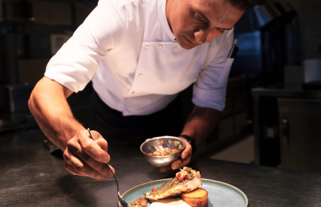 Professional Chef plating up a dish