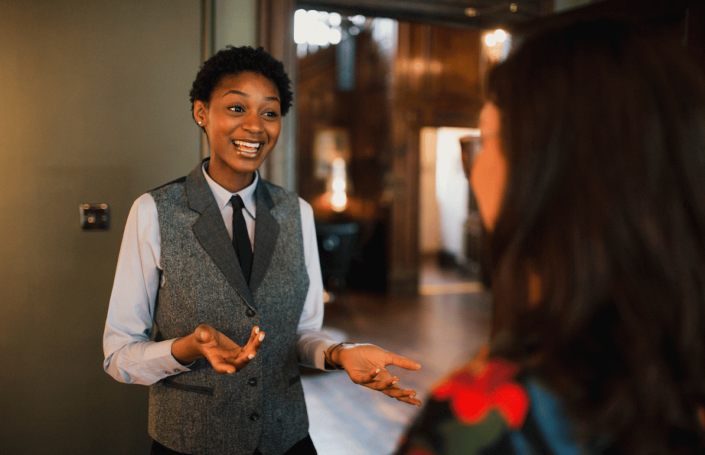 Female hospitality worker talking to a hotel guest