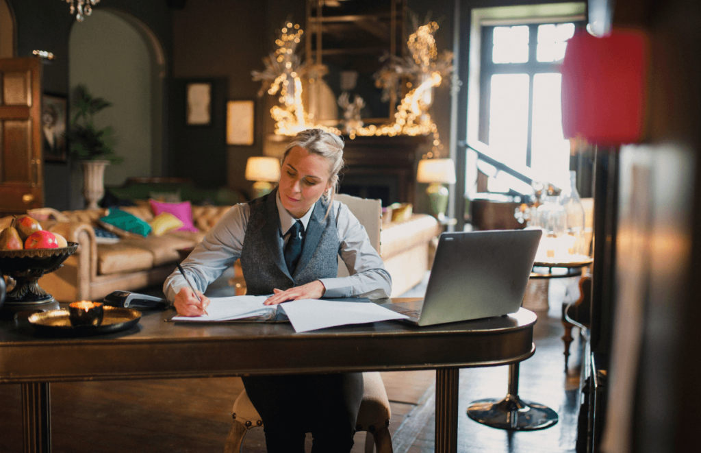 A hospitality Manager sat working at a desk