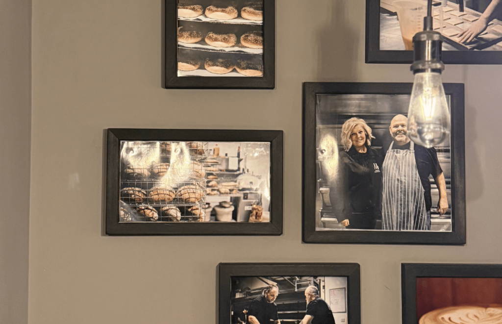 Family photos on the wall at Patisserie Mark Bennett